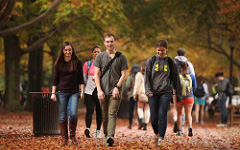 students walking between classes in fall