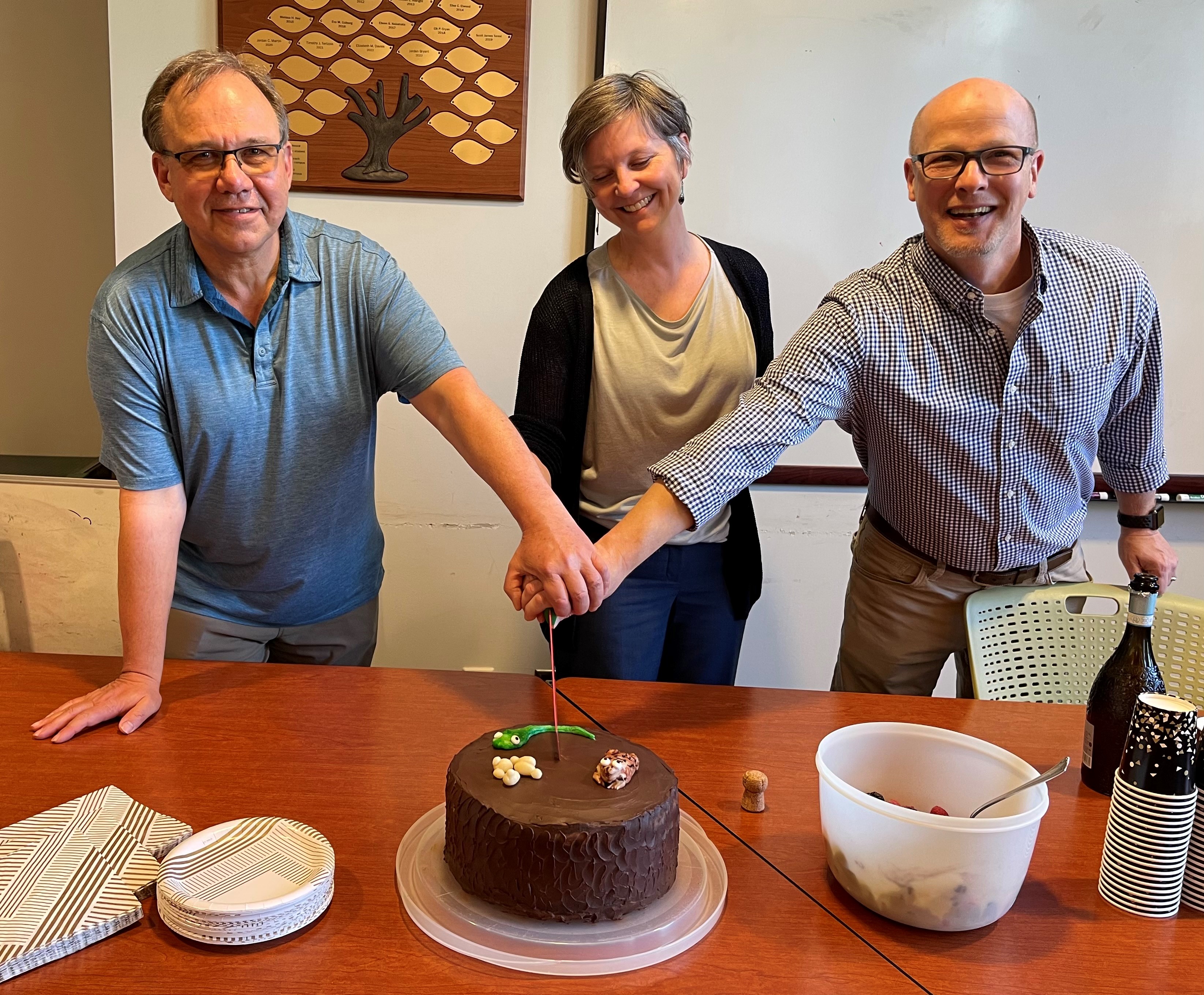 Caption: April 24, 2024 departmental party to toast and congratulate the newly tenured and promoted Associate Professor Jen Bestman and the promoted Professors Oliver Kerscher and Matthias Leu (cake by Biology Chair, Liz Allison)