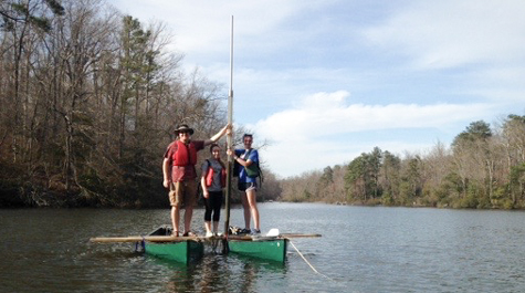 geologist Jim Kaste works with undergraduates Kassandra Smith and Meredith Meyer from a coring platform assembled from a couple of lashed-together canoes on Lake Matoaka.