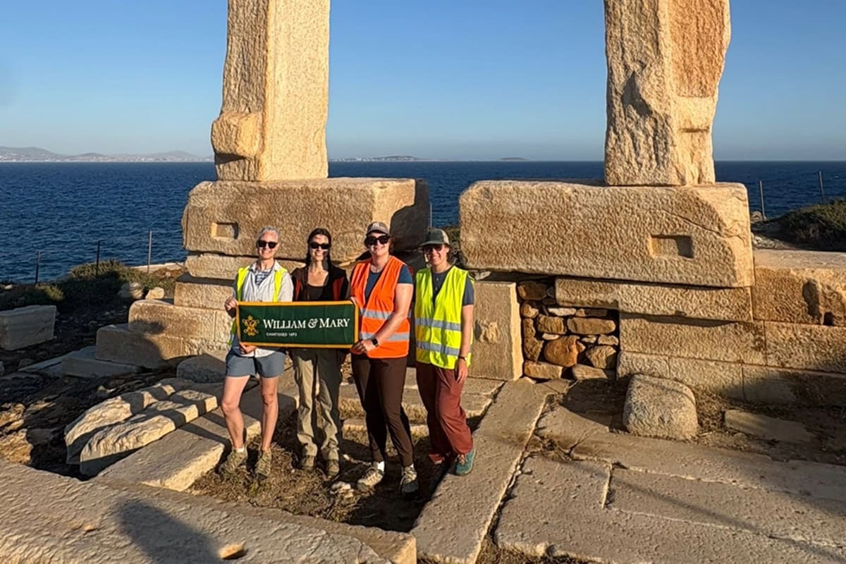 A W&M research team standing in front of the unfinished temple on Palatia, an islet off the coast of the Greek island Naxos.