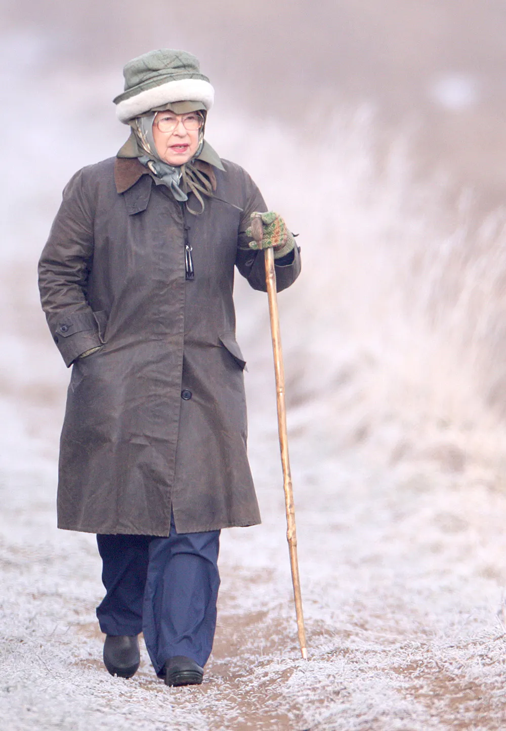 Queen Elizabeth II wearing two hats in the snow