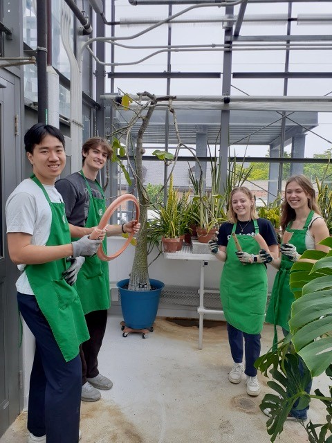 student workers in the greenhouse