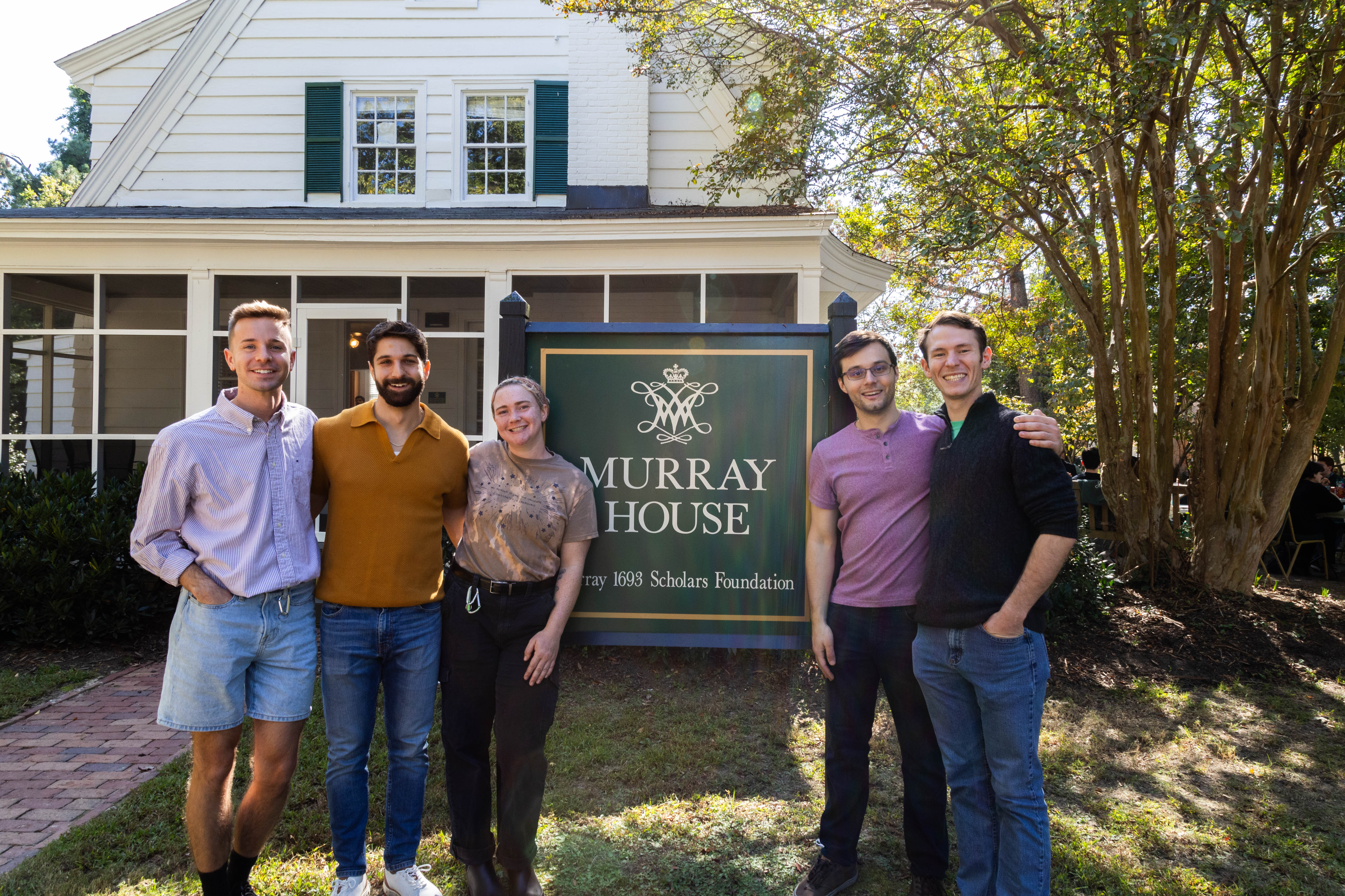 There's no place like Murray House: 1693 Scholars Program Class of 2020 alums Jared Bergen, Mike Giovanniello, Hali Pregnall, Jack Shangraw, and Jack Morris (left to right) celebrate Homecoming last month at 1693 headquarters. (Photo by Tess Willett) 