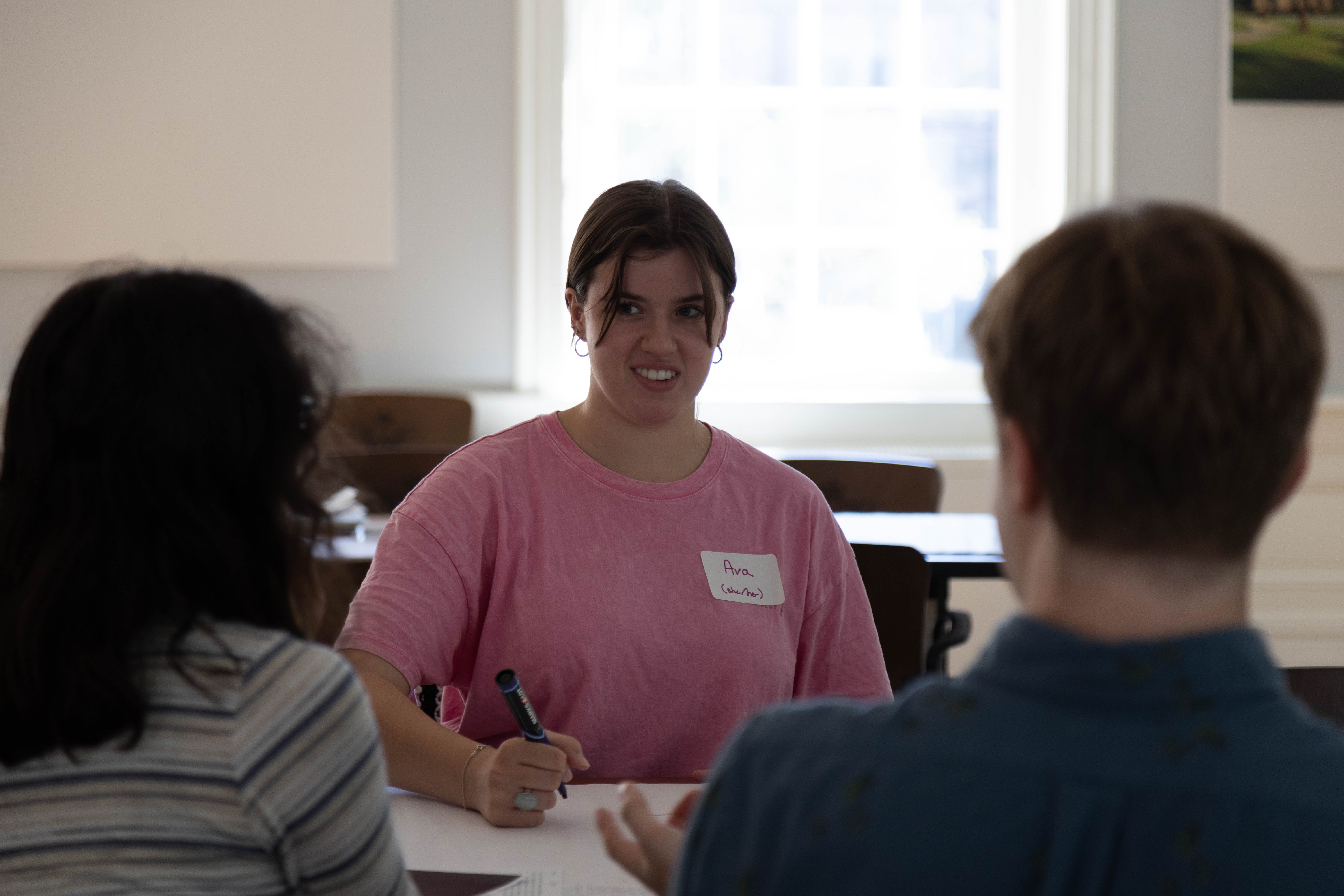 Ava Noce ‘26, a junior majoring in sociology with a concentration in social justice and policy, discusses the ethics of reporting on difficult situations. (Photo by Tess Willett)