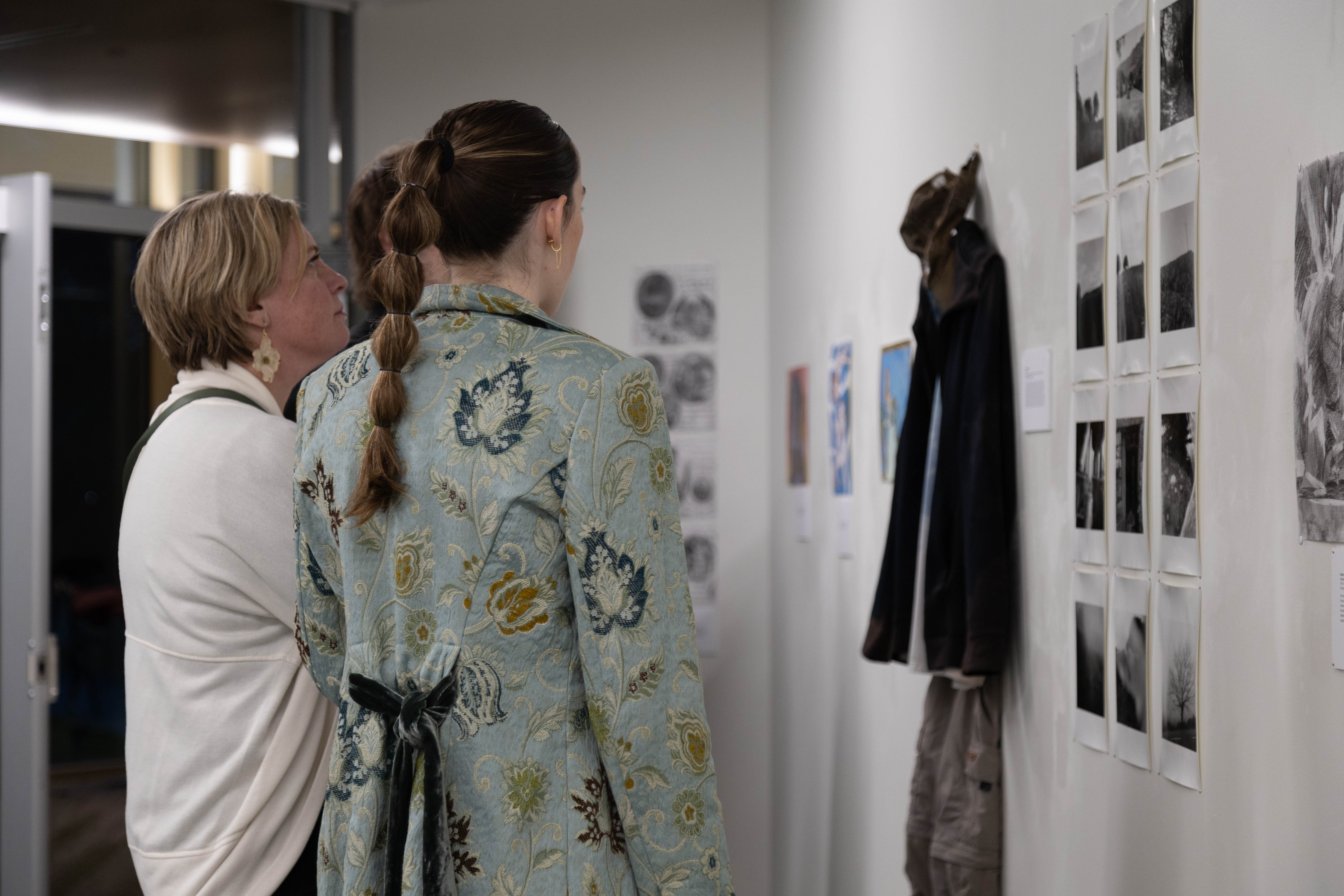 Artists and attendees view works created by Catron scholars, displayed in Sadler Center's Hart Gallery Nov. 11-22. (Photo by Tess Willett)