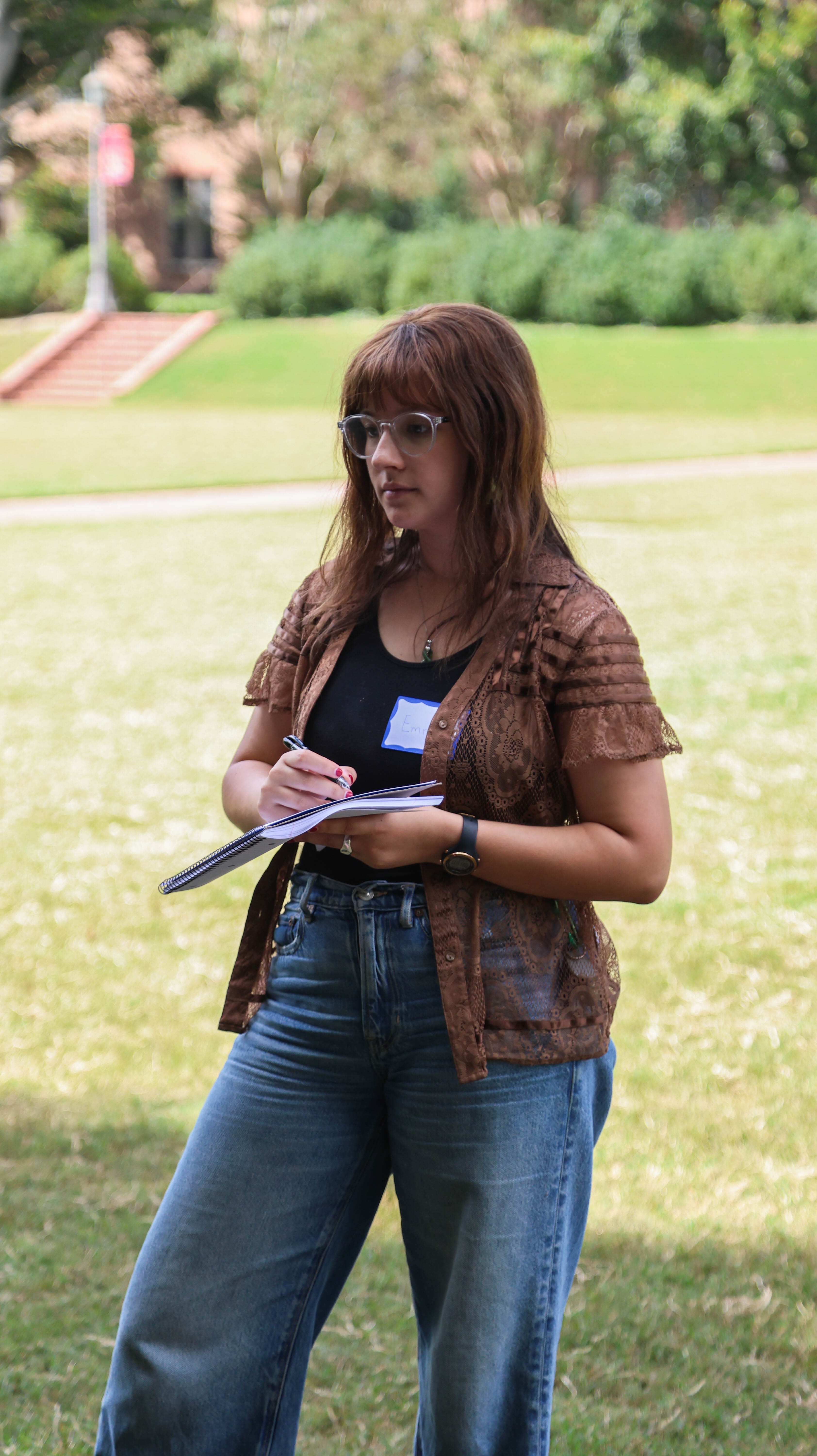 Emma Henry '25 interviews students as part of a hands-on reporting exercise in Denise Watson's journalism masterclass. (Photo by Tess Willett)