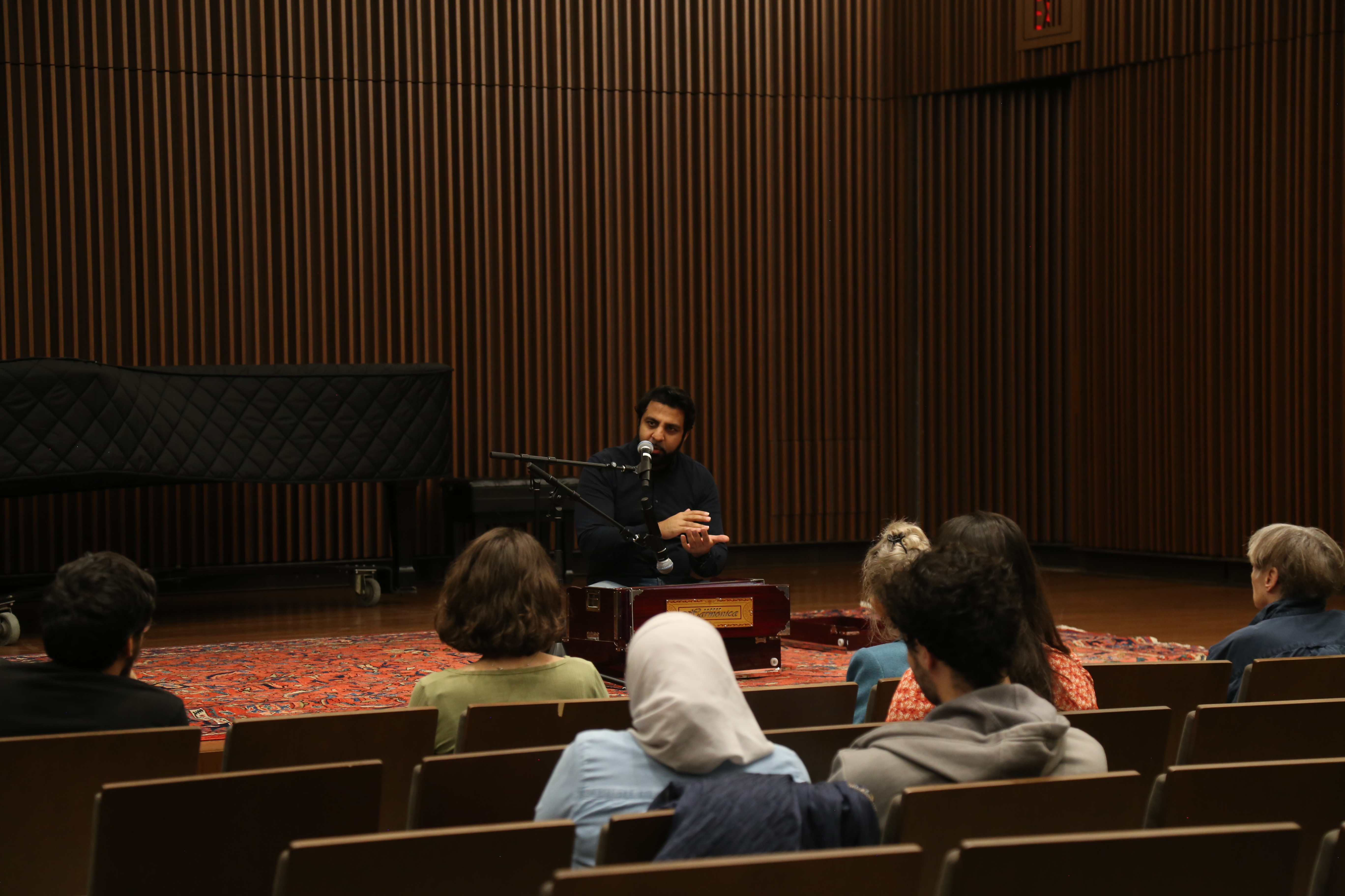 Sonny K. Mehta, artistic director of Riyaaz Qawwali, explains the role of the harmonium in Sufi sacred music during a masterclass in the Comey Recital Hall in William & Mary's Music Arts Center Nov. 11. (Photo by Addie Steel)