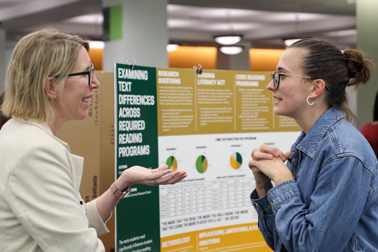 Margaret Barr '25 (right), psychology and elementary education double-major, discusses her research with advisor, Dr. Virginia L. McLaughlin Associate Professor of Education Kristin Conradi Smith (left). (Photo by Tess Willett)