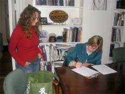 Mayor Zeidler reviews the greening suggestions for her house with Gina Sobel '07, one of BPEI’s founders.