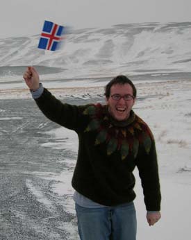 Justin Butterworth waves an Icelandic flag during his last week in the country.