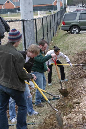 SEAC members work in the campus garden.