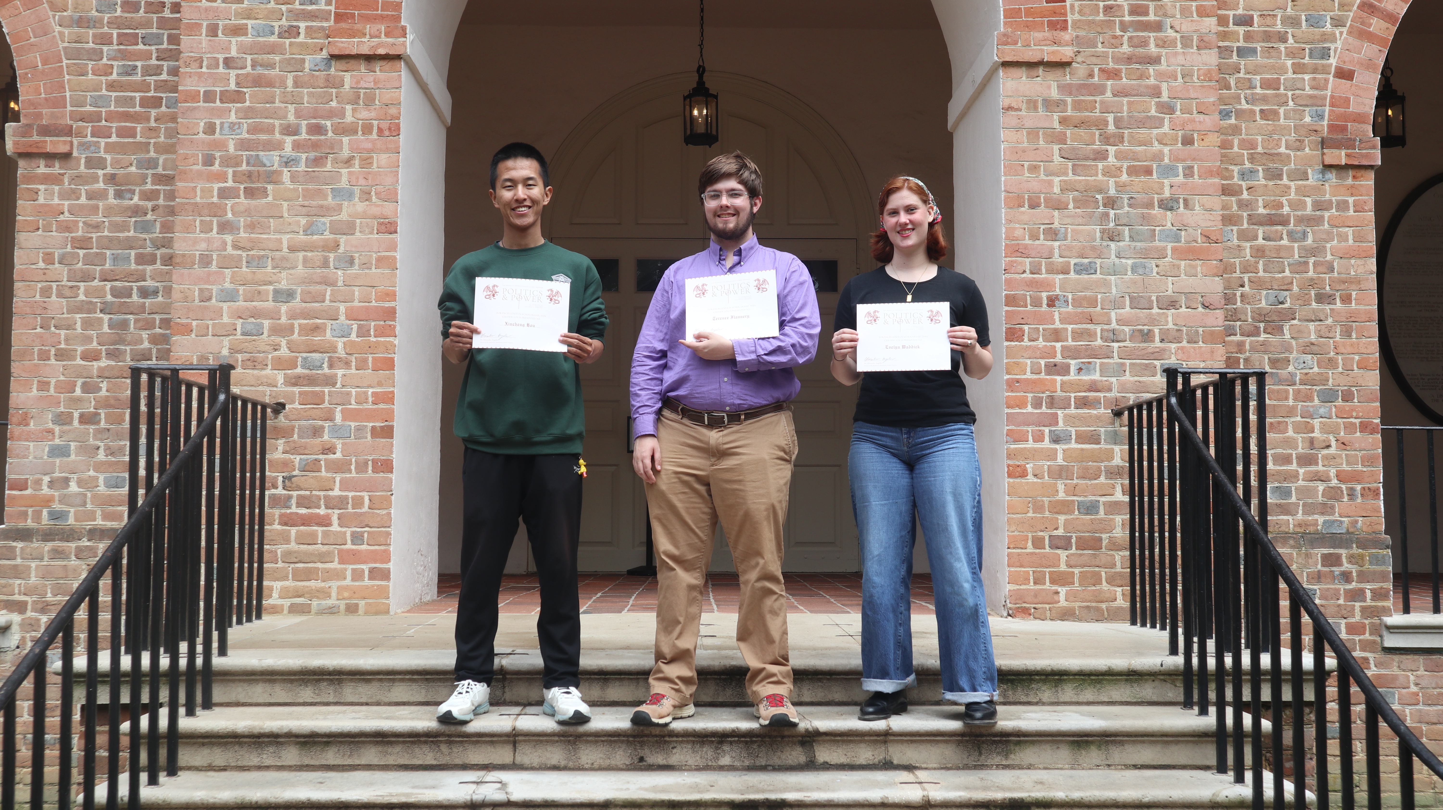 This year's Award Recipients (from left to right): Xincheng Hou, Terence Flannery, and Evelyn Waddick stand outside the Wren Building.