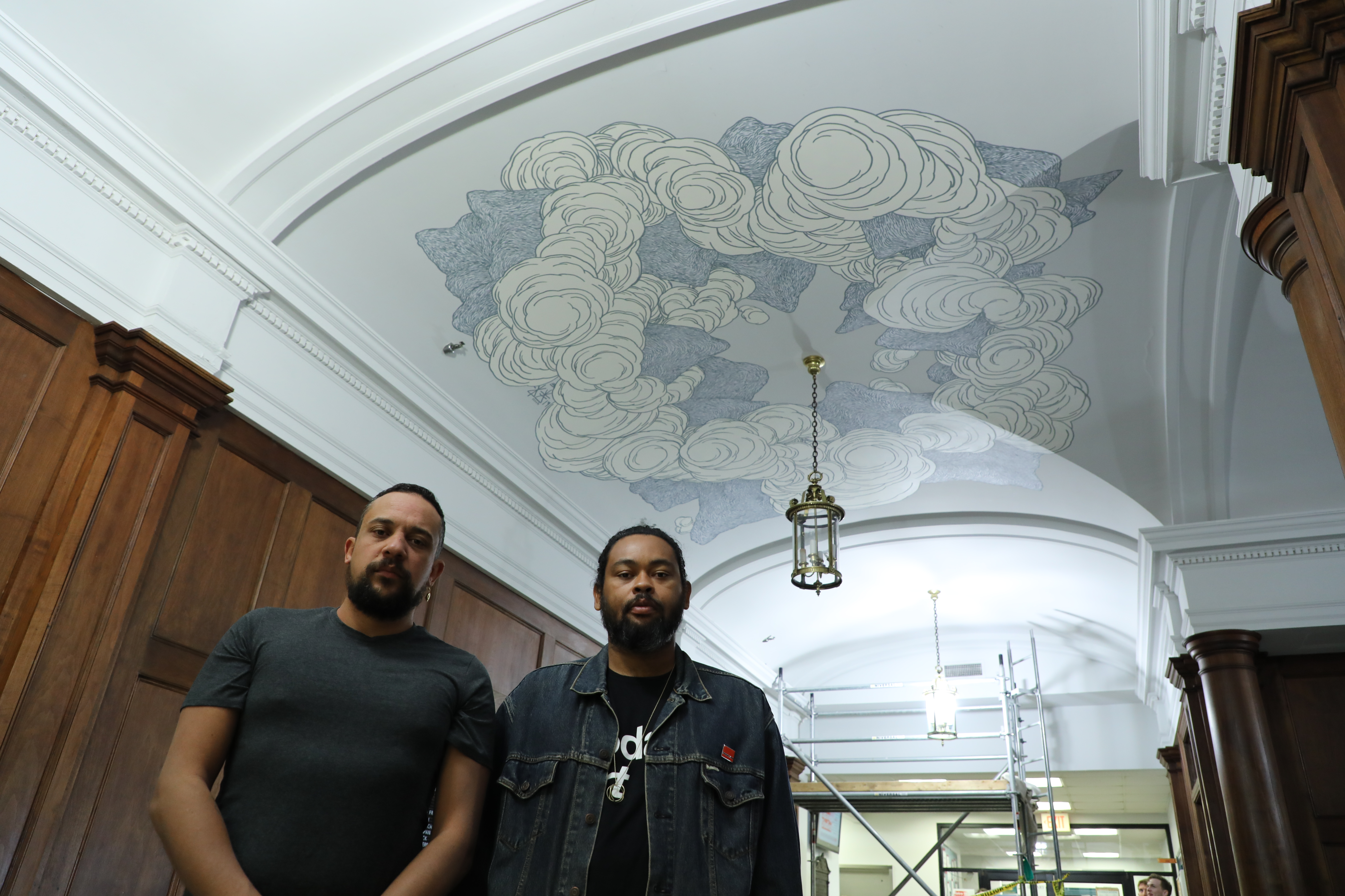 Reunion Island artists Kid Kreol and Boogie with their mural on the Washington Hall lobby ceiling