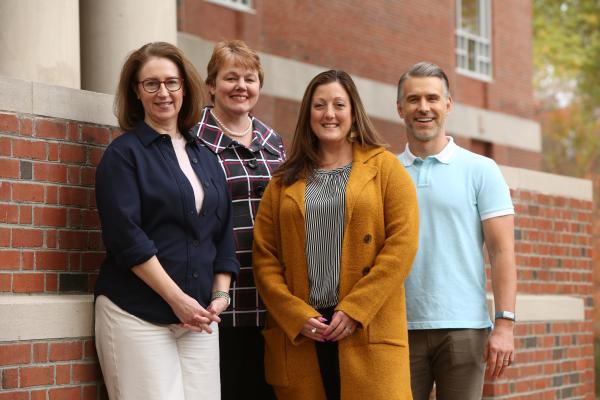 Members of the team representing W&amp;M at the Institute on AI, Pedagogy, and the Curriculum (left to right): Lori Jacobson, Candice Benjes-Small, Katalin Wargo and Mark Deming (Photo by Stephen Salpukas)