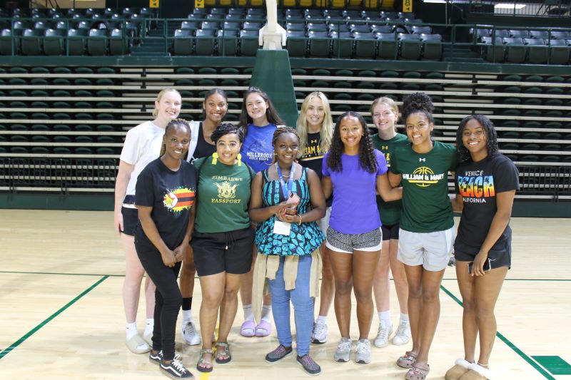 group photo of fellows and members of W&M basketball team