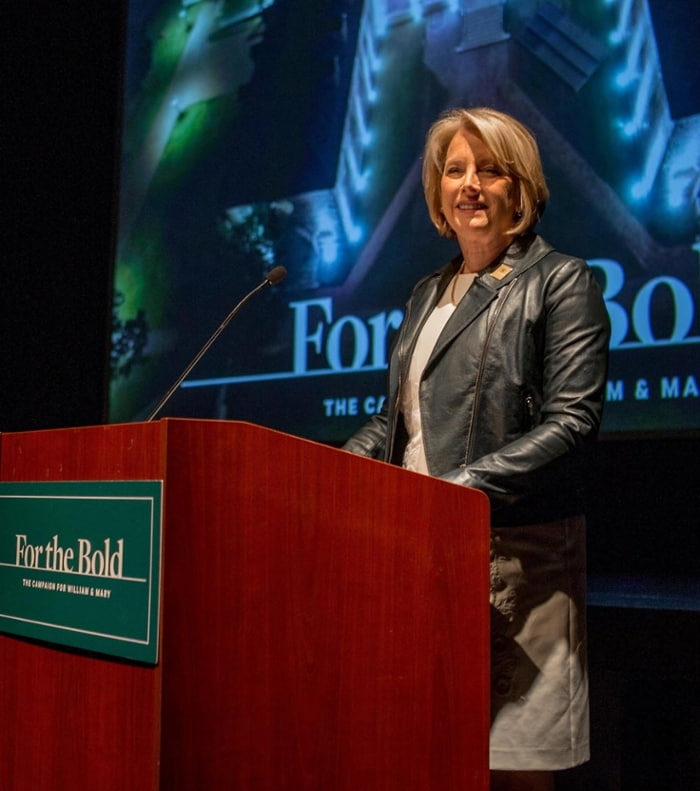 Sue Gerdelman at a For the Bold campaign event standing a a podium